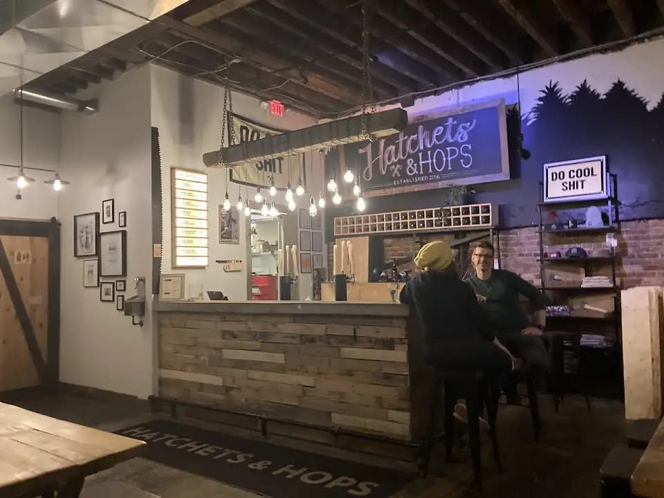 Interior view of Hatchets & Hops axe throwing facility in Toronto